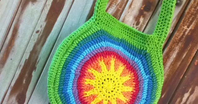 Sunshine Rainbow Round Crochet Bag finished front view with colourful sun motif 